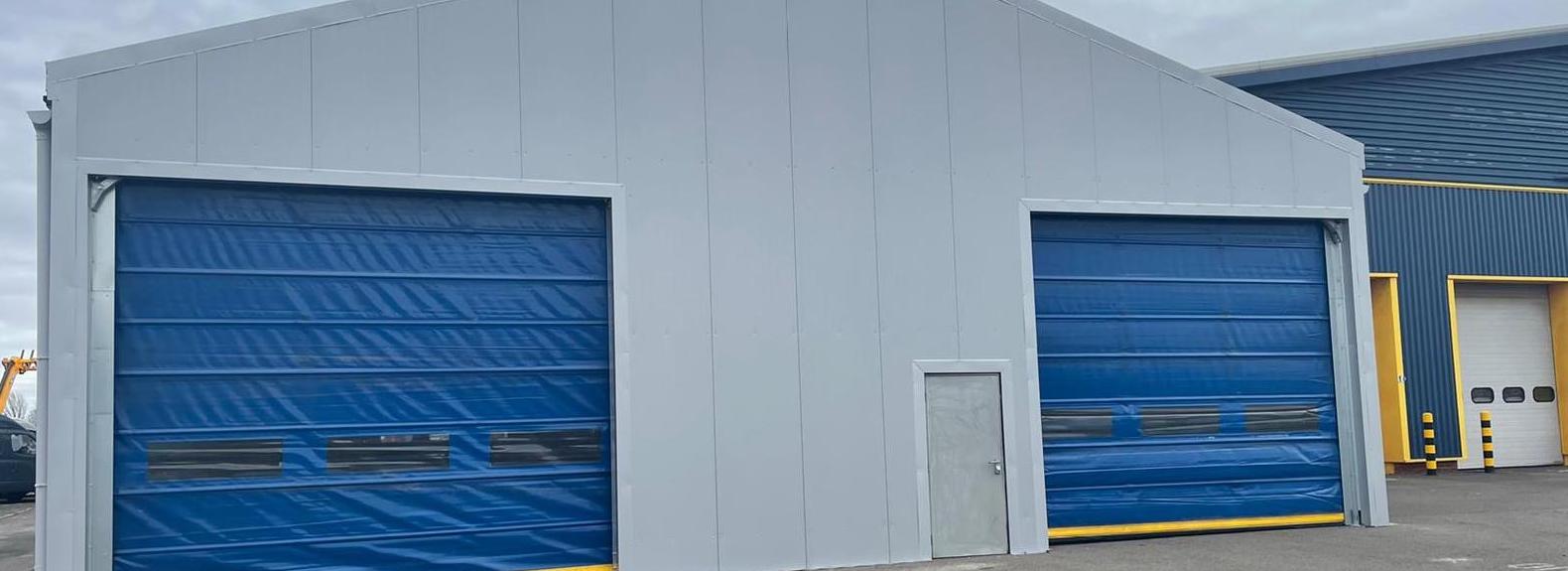 Temporary building with blue doors