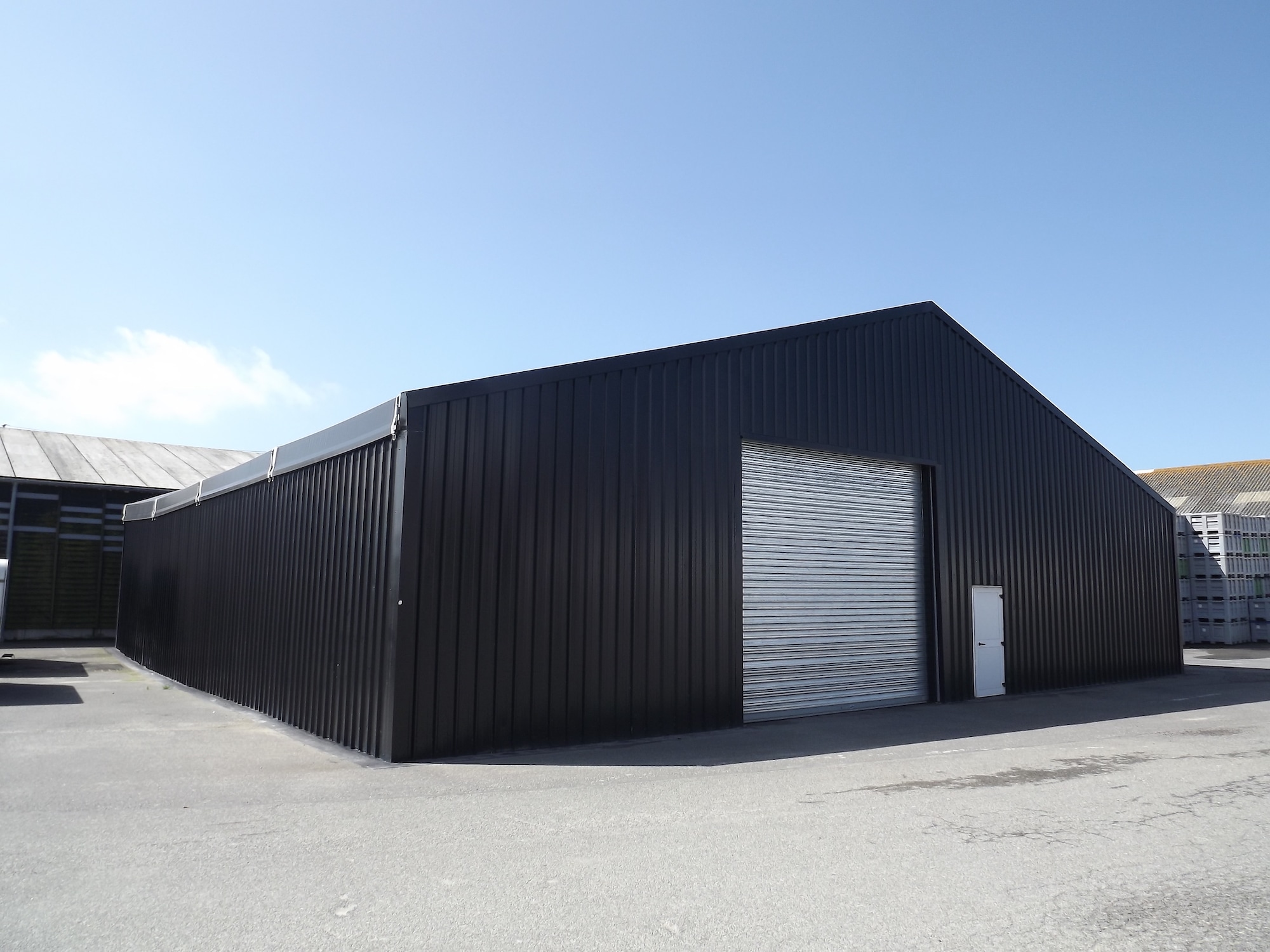 Dark coloured temporary building